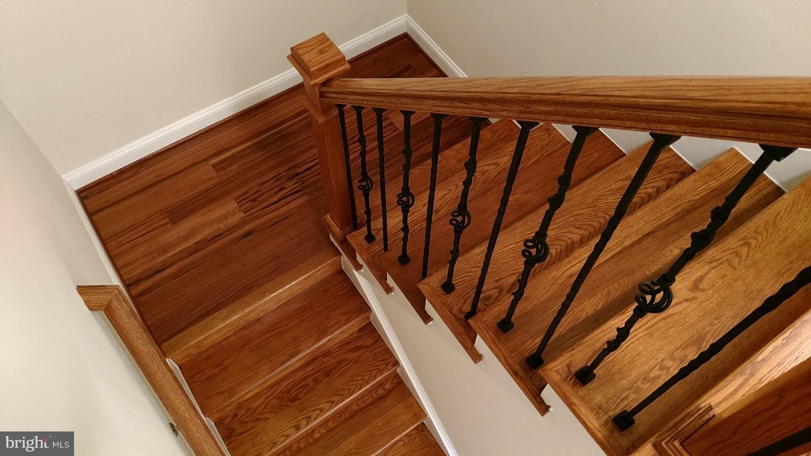 1035 Windrush Lane, Unit 9 Sandy Spring, MD 20860 - Photo 13 of 26 Read Oak Stairs with Iron Spindles