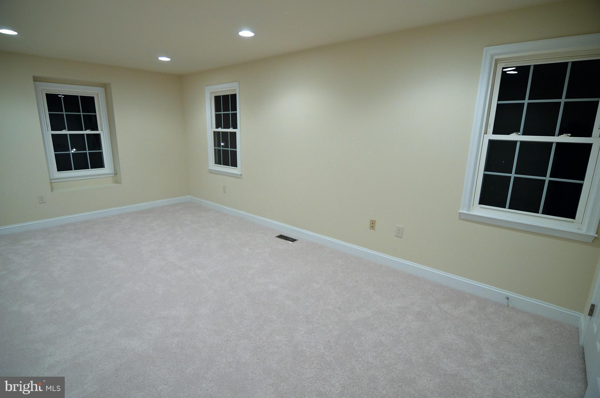1035 Windrush Lane, Unit 9 Sandy Spring, MD 20860 - Photo 14 of 26 Master bedroom with 3 windows and seating ledge