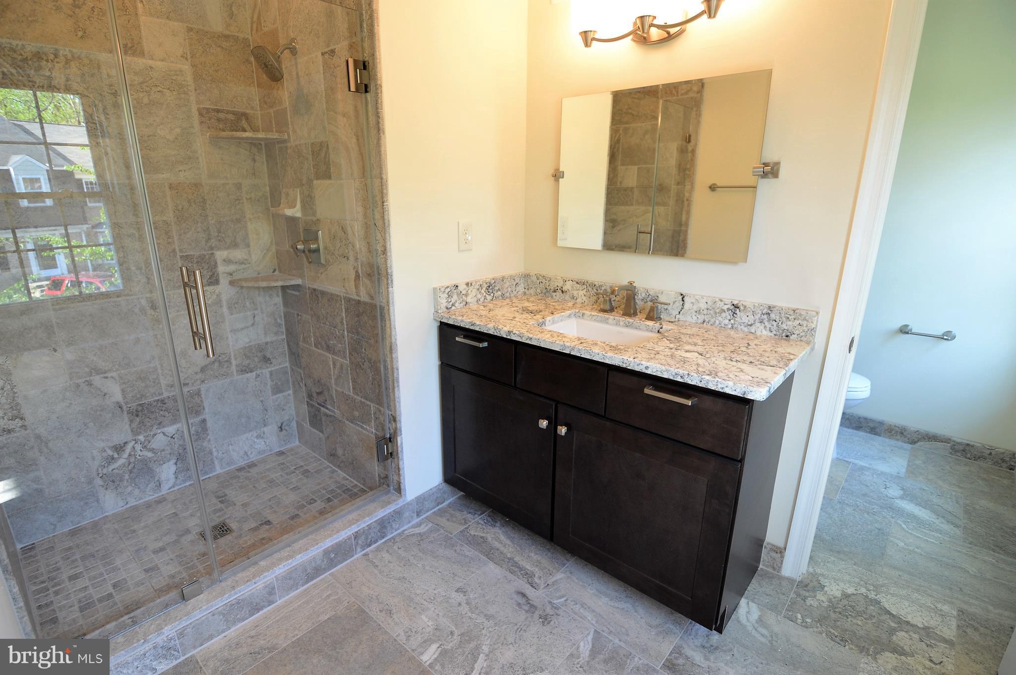 1035 Windrush Lane, Unit 9 Sandy Spring, MD 20860 - Photo 15 of 26 Masterbath with granite and travertine