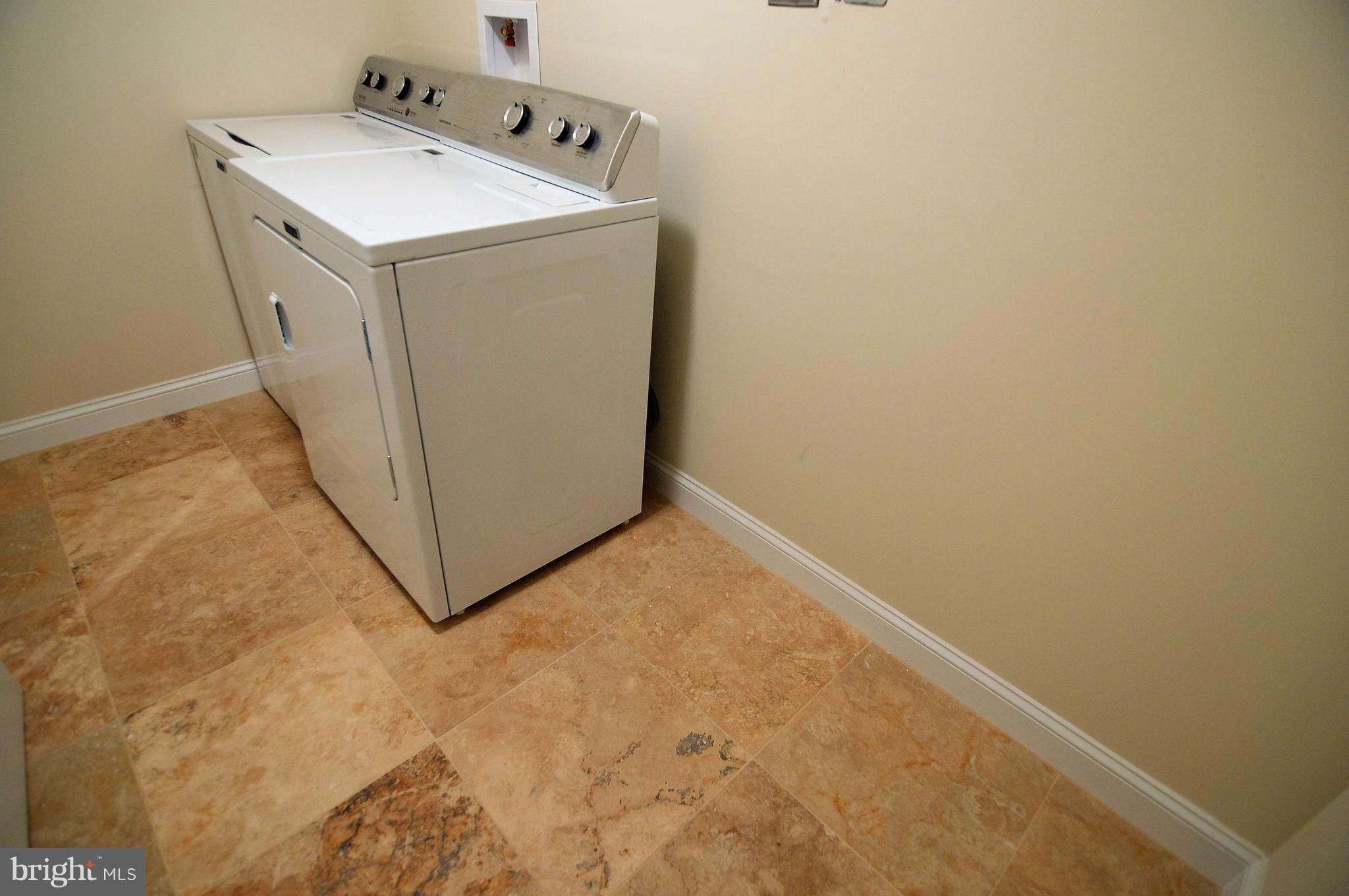 1035 Windrush Lane, Unit 9 Sandy Spring, MD 20860 - Photo 23 of 26 Large finished laundry room with travertine tile