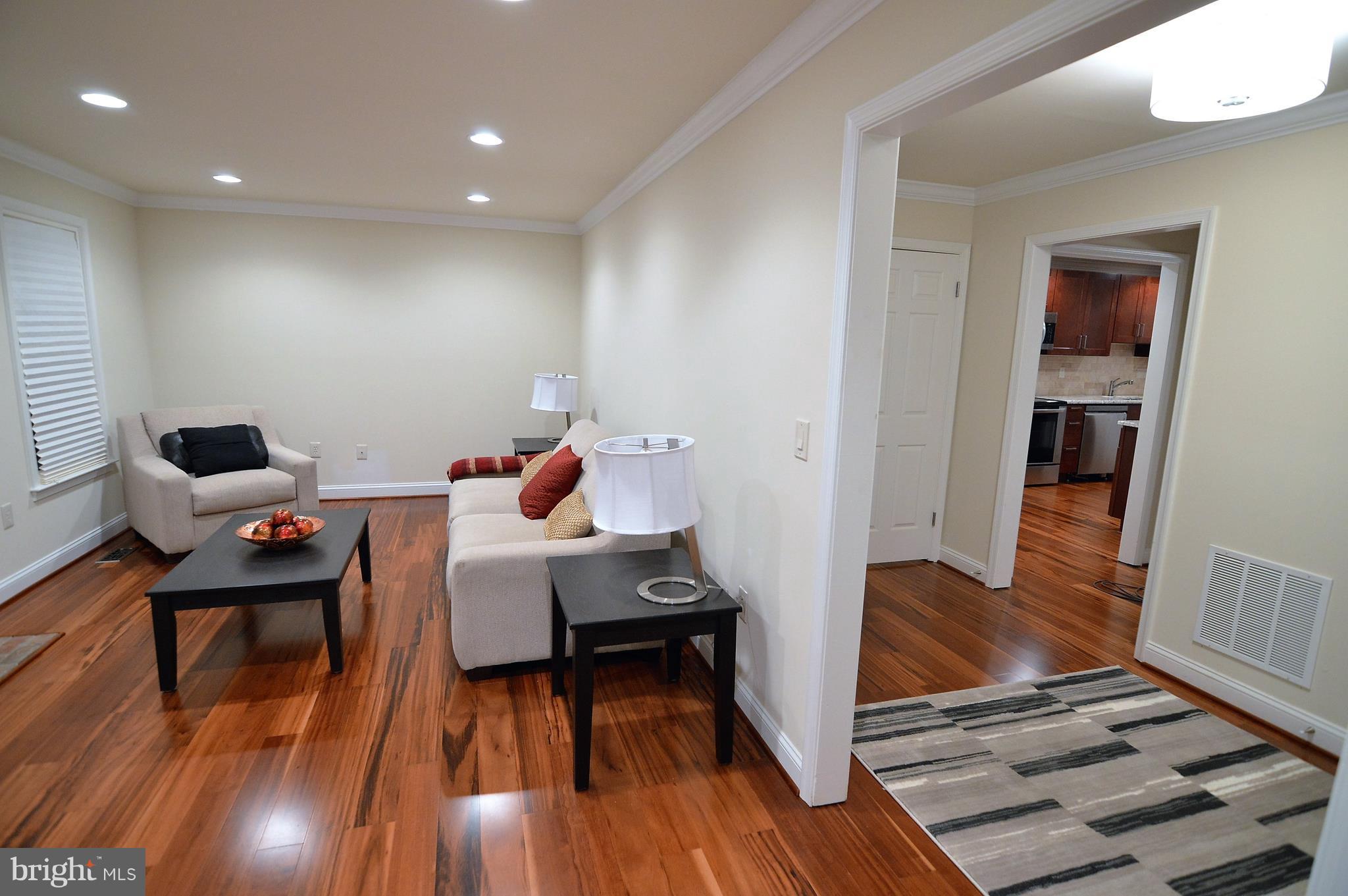 1035 Windrush Lane, Unit 9 Sandy Spring, MD 20860 - Photo 5 of 26 Family room with Tigerwood flooring.