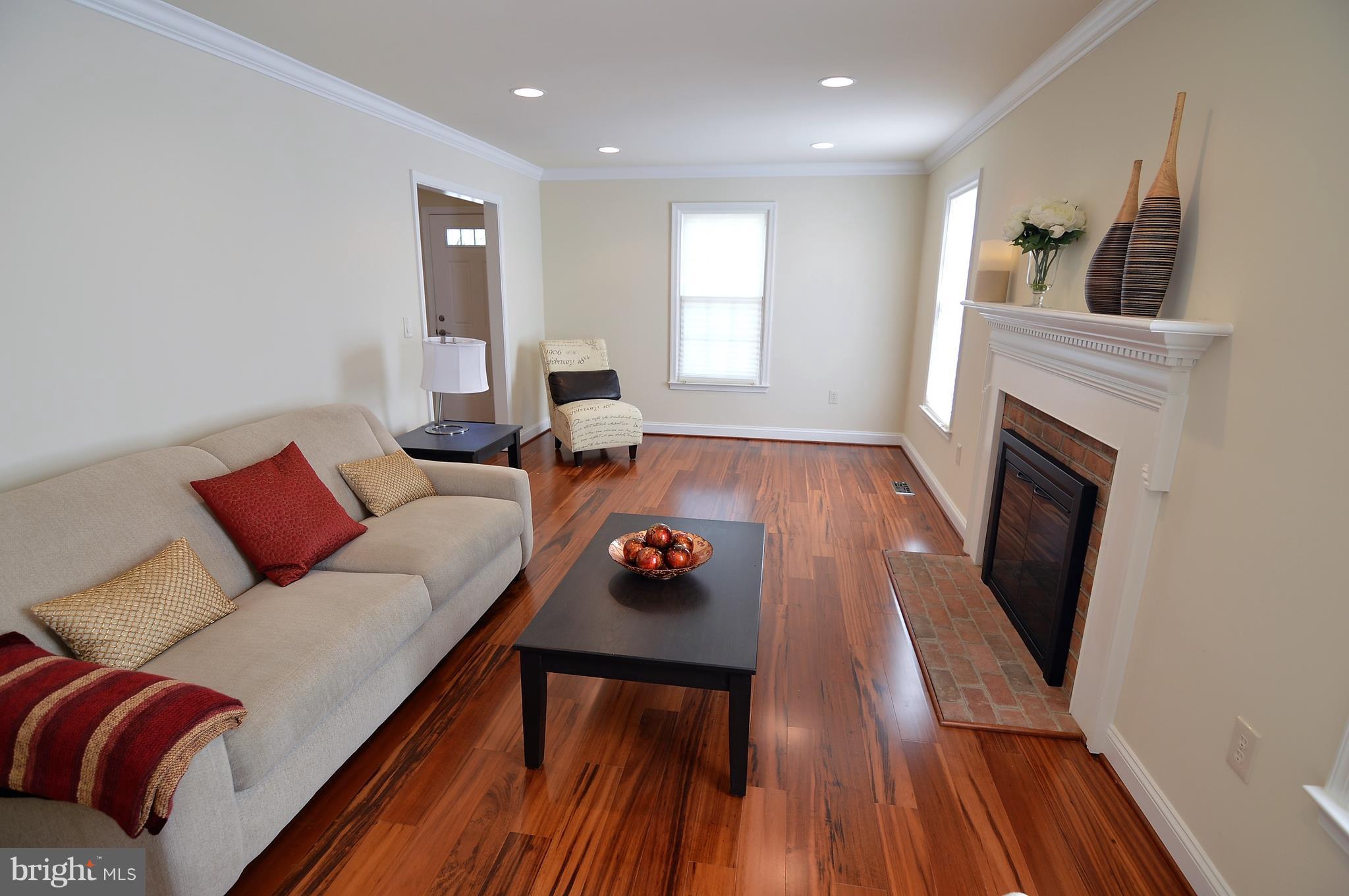 1035 Windrush Lane, Unit 9 Sandy Spring, MD 20860 - Photo 7 of 26 Family room with wood burning fireplace