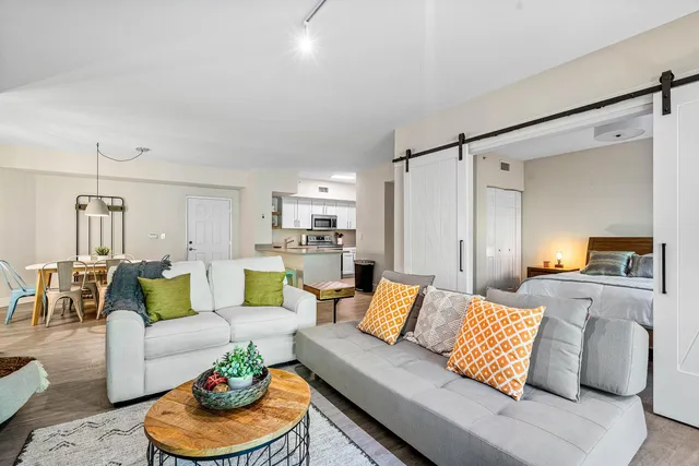 a kitchen with granite countertop a sink and cabinets
