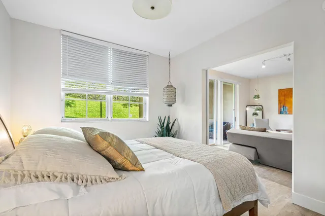 a bathroom with a double vanity sink toilet and a mirror