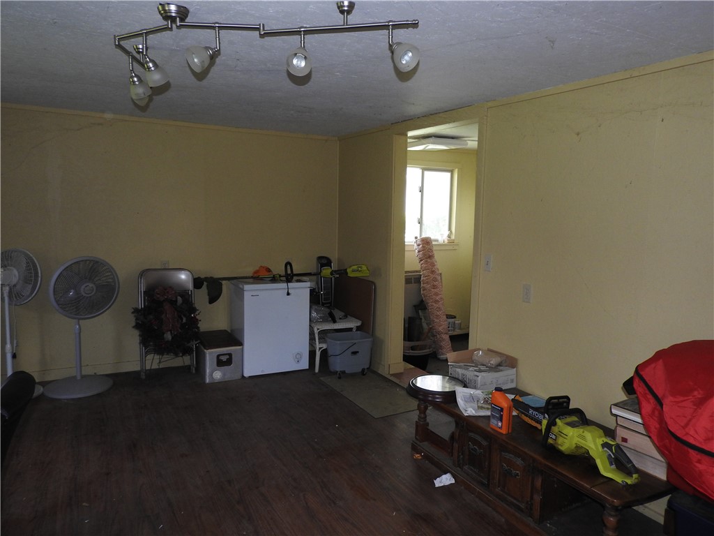 2185 East Loy Road Piqua, OH 45356 - Photo 7 of 19 This versatile room features durable flooring and offers ample space for various needs.