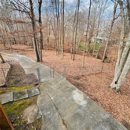 a front view of a house with a wooden deck