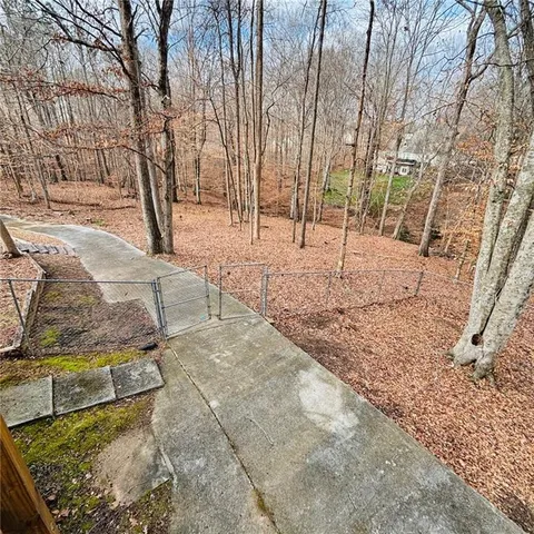 a front view of a house with a wooden deck