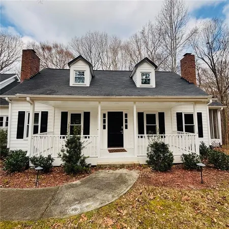 a front view of a house with yard