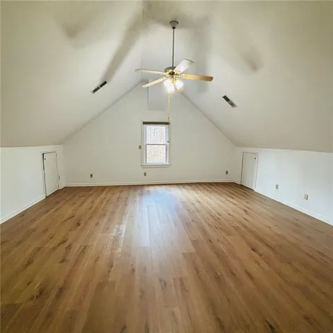 a bathroom with a granite countertop sink mirror and vanity