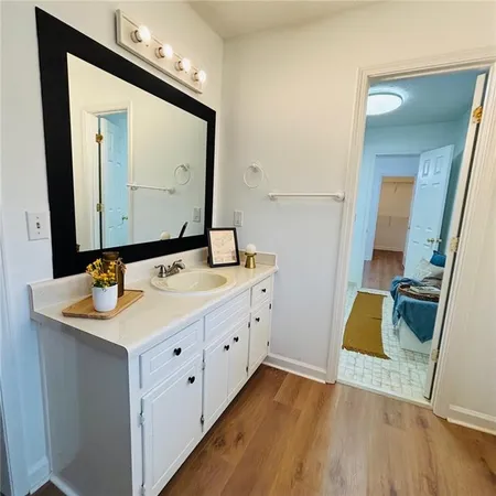 a white toilet sitting next to a bathroom sink