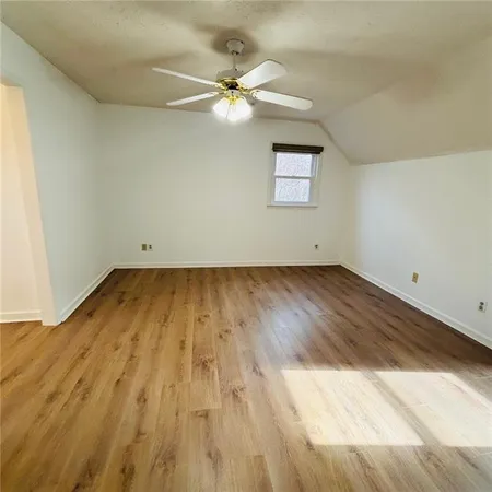 a view of a small space with wooden floor