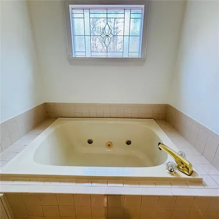 a view of an empty room with a large window