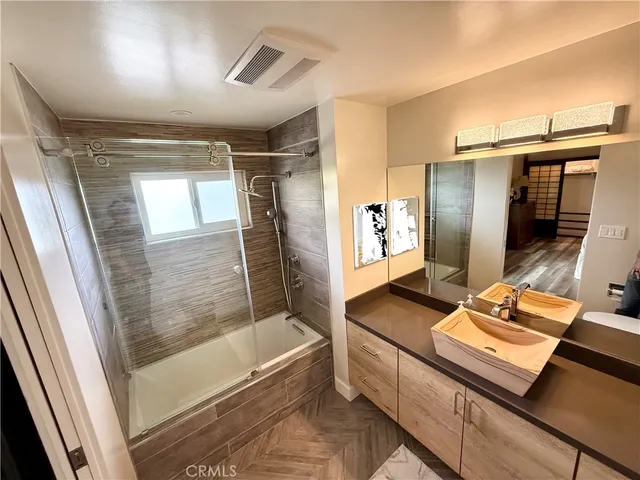 a bathroom with a tub and a shower