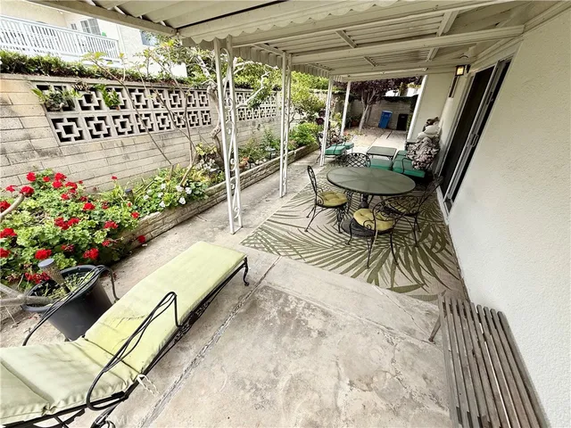 a view of a chairs and table in the patio