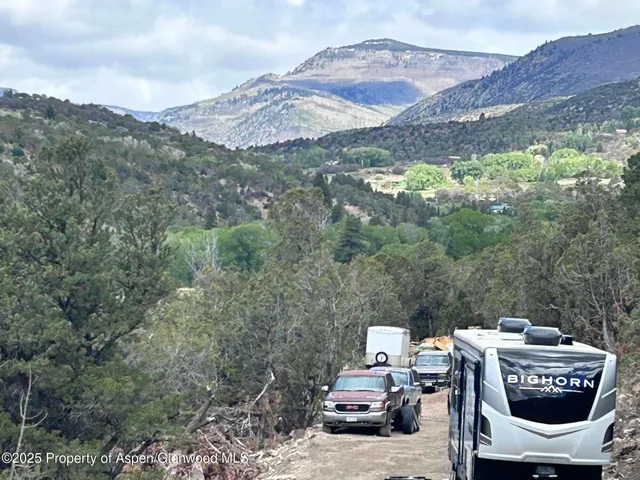 a terrace with outdoor seating and mountain view