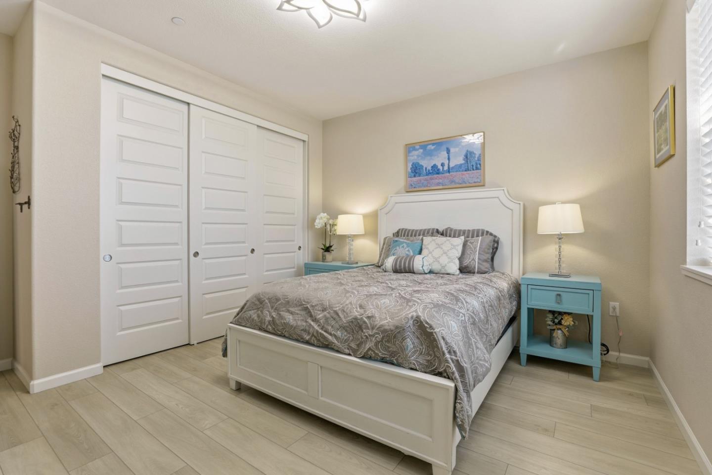 6385 Paysar Lane Gilroy, CA 95020 - Photo 12 of 27 a spacious bedroom with a bed and a cabinets