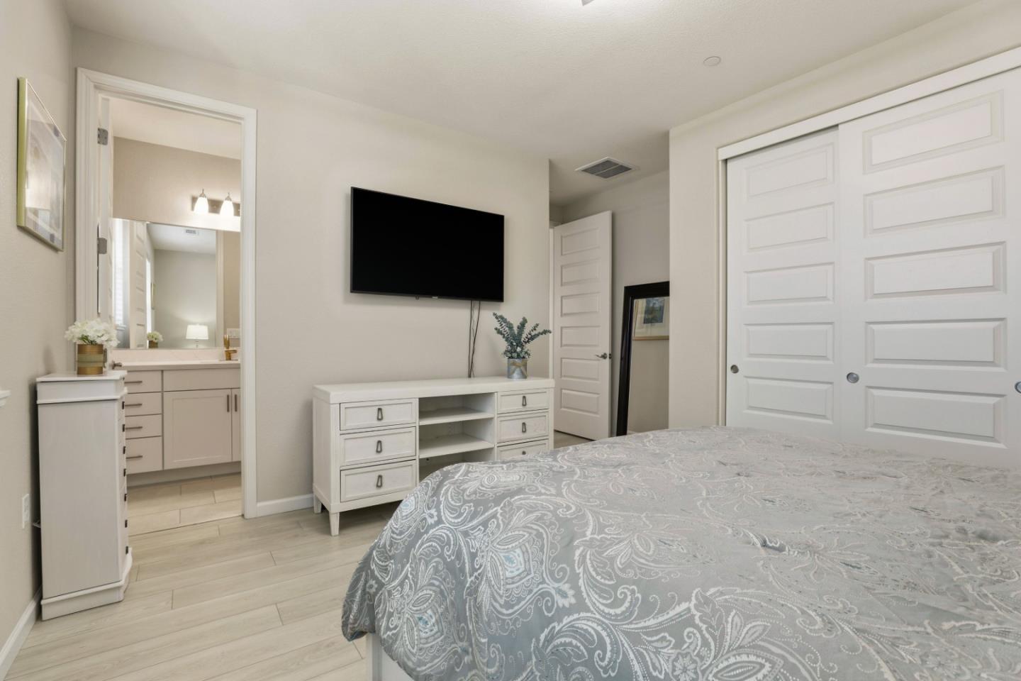 6385 Paysar Lane Gilroy, CA 95020 - Photo 13 of 27 a bedroom with a bed and a flat screen tv