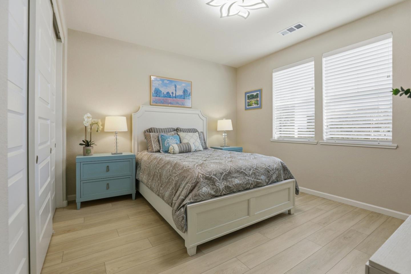 6385 Paysar Lane Gilroy, CA 95020 - Photo 15 of 27 a spacious bedroom with a bed and a window