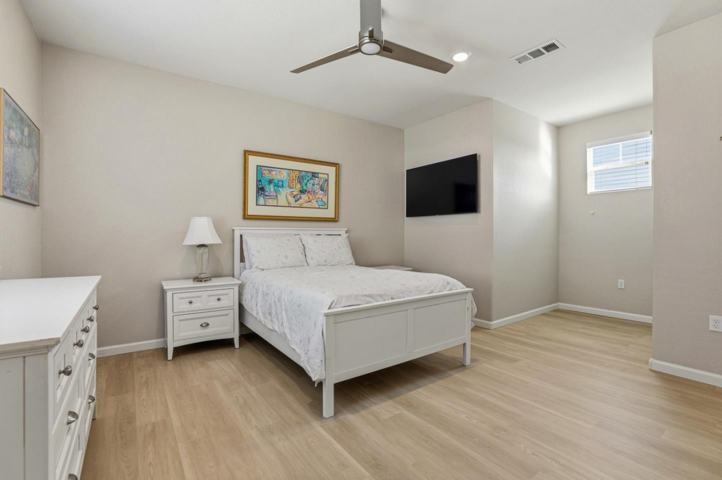6385 Paysar Lane Gilroy, CA 95020 - Photo 19 of 27 a bedroom with a bed and a flat screen tv
