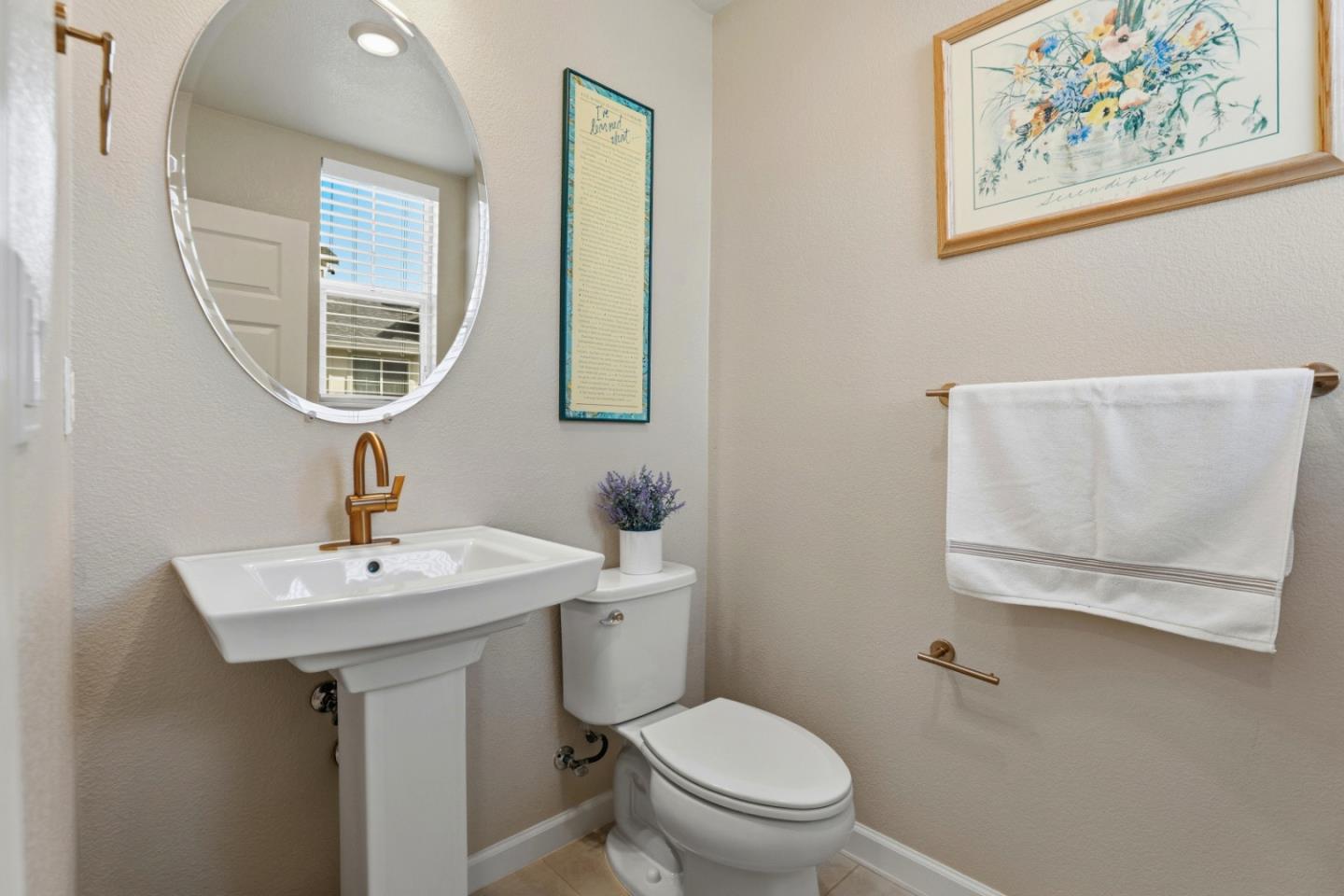 6385 Paysar Lane Gilroy, CA 95020 - Photo 23 of 27 a bathroom with a toilet a sink and a mirror