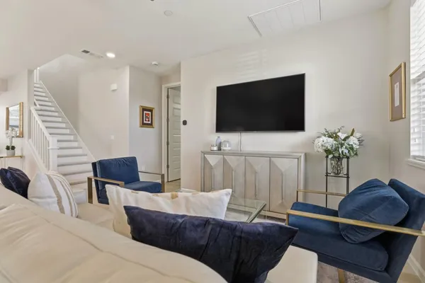 a living room with furniture and a flat screen tv
