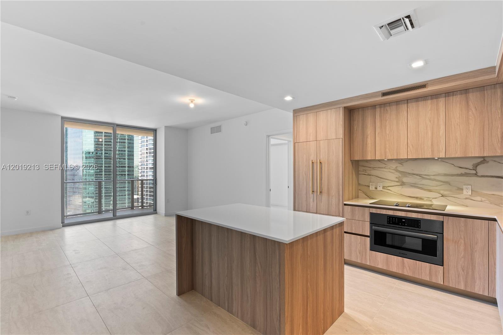 77 Southeast 5th, Unit 3702 Miami, FL 33131 - Photo 6 of 63 a kitchen with stainless steel appliances granite countertop a stove and a sink