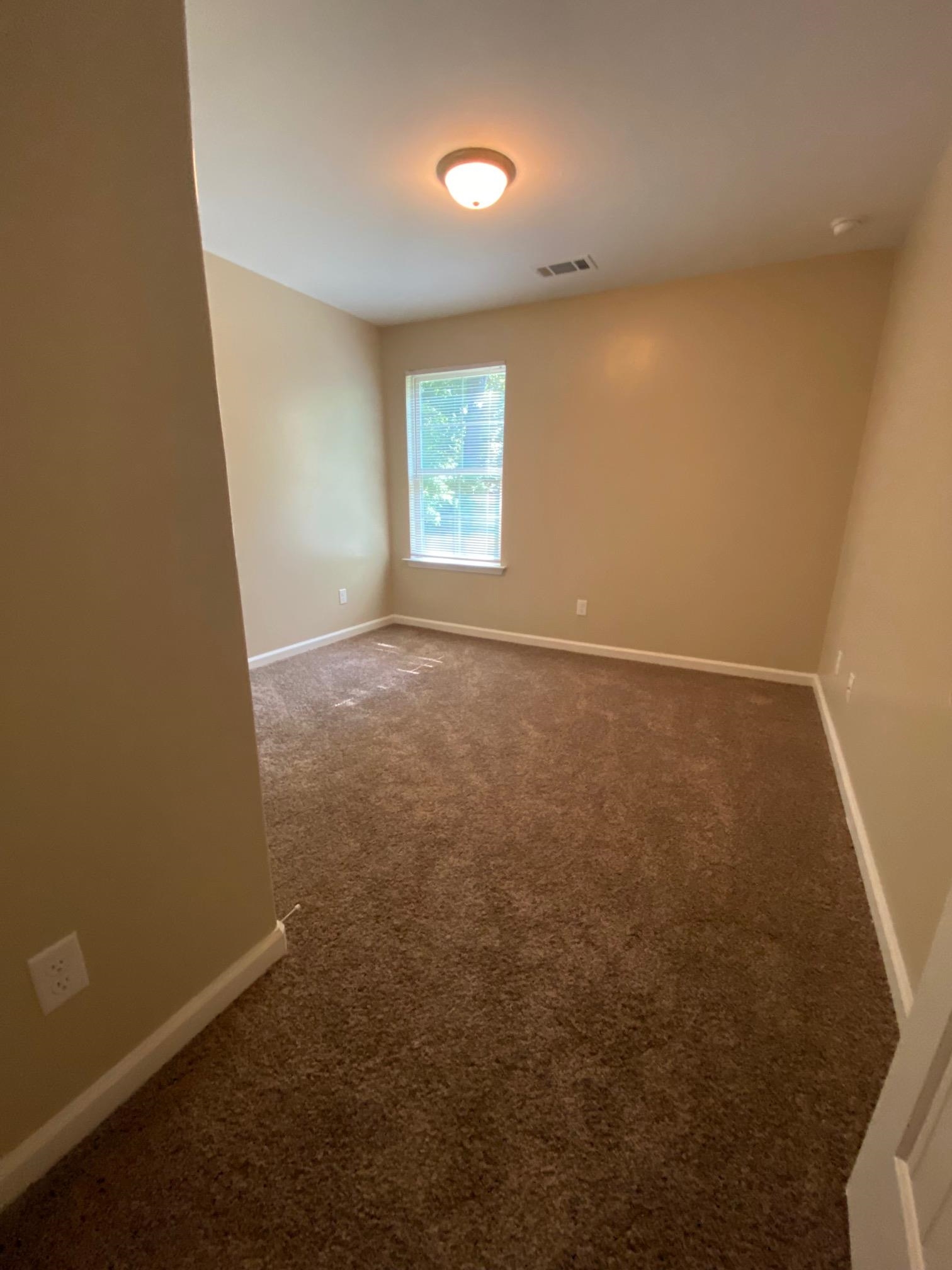 2260 Webbing Drive Memphis, TN 38016 - Photo 13 of 17 an empty room with windows