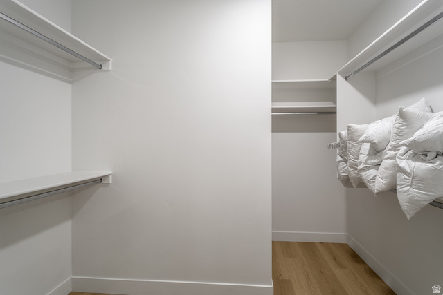 2768 Becco Trail, Unit 63 St. George, UT 84770 - Photo 12 of 27 Walk in closet with light wood-style floors