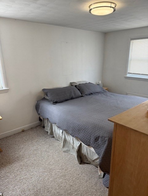 40 Brookline Avenue Hull, MA 02045 - Photo 13 of 24 a bedroom with a bed and a window