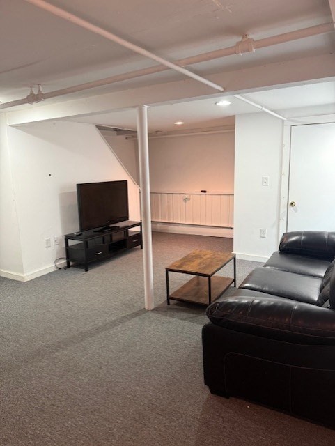 40 Brookline Avenue Hull, MA 02045 - Photo 16 of 24 a living room with furniture and a flat screen tv