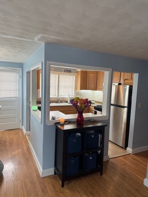 40 Brookline Avenue Hull, MA 02045 - Photo 4 of 24 a room with stainless steel appliances granite countertop a refrigerator a sink and a stove