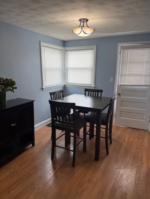 40 Brookline Avenue Hull, MA 02045 - Photo 7 of 24 a view of a dining room with furniture and wooden floor
