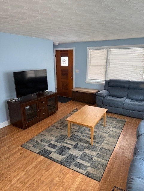 40 Brookline Avenue Hull, MA 02045 - Photo 8 of 24 a living room with furniture and a flat screen tv