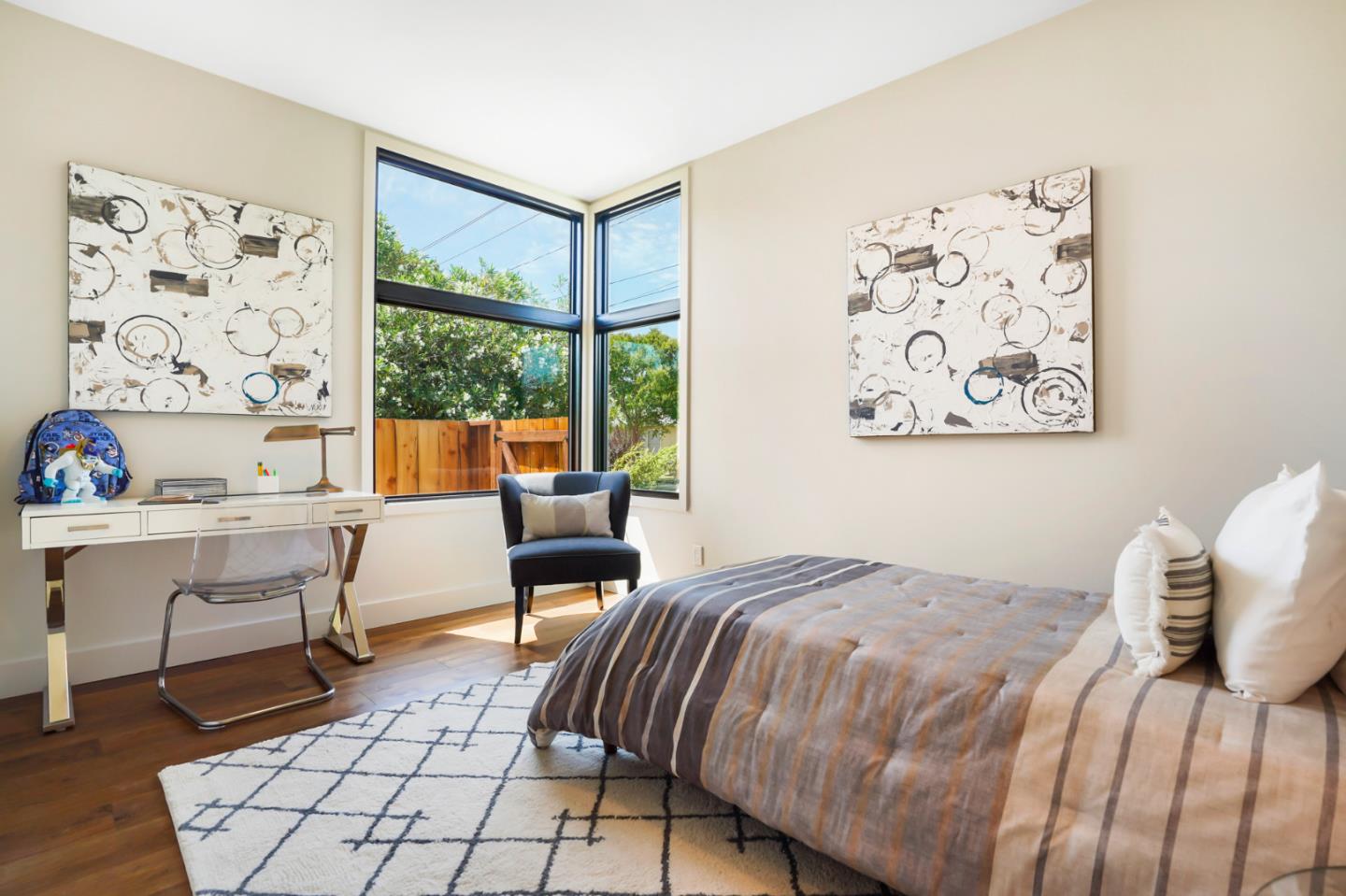 737 Ruby Street Redwood City, CA 94061 - Photo 14 of 26 a bedroom with a bed and a table in it with window