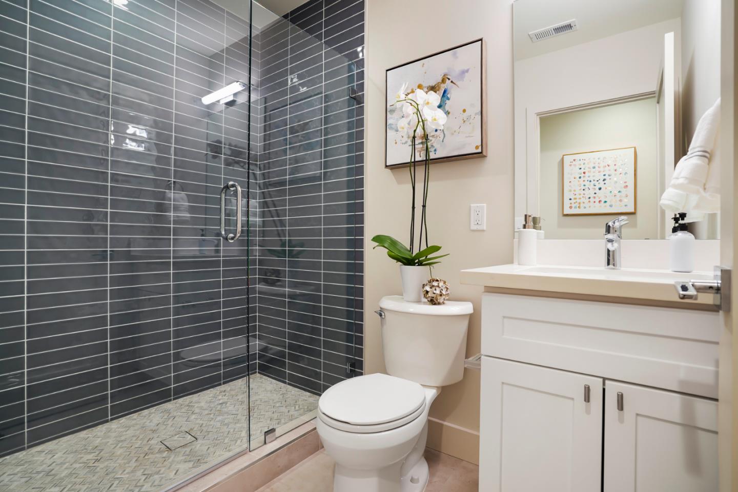 737 Ruby Street Redwood City, CA 94061 - Photo 15 of 26 a bathroom with a toilet sink vanity and mirror