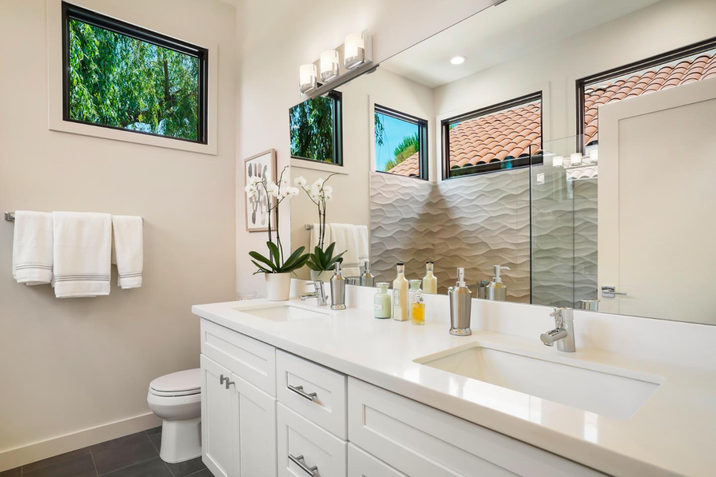 737 Ruby Street Redwood City, CA 94061 - Photo 18 of 26 a bathroom with a granite countertop toilet sink and mirror