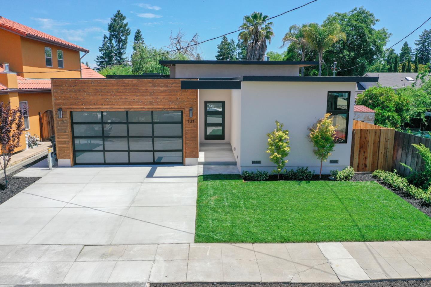 737 Ruby Street Redwood City, CA 94061 - Photo 20 of 26 a front view of a house with a garden
