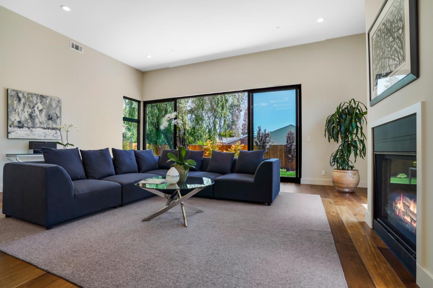 737 Ruby Street Redwood City, CA 94061 - Photo 4 of 26 a living room with furniture and a flat screen tv
