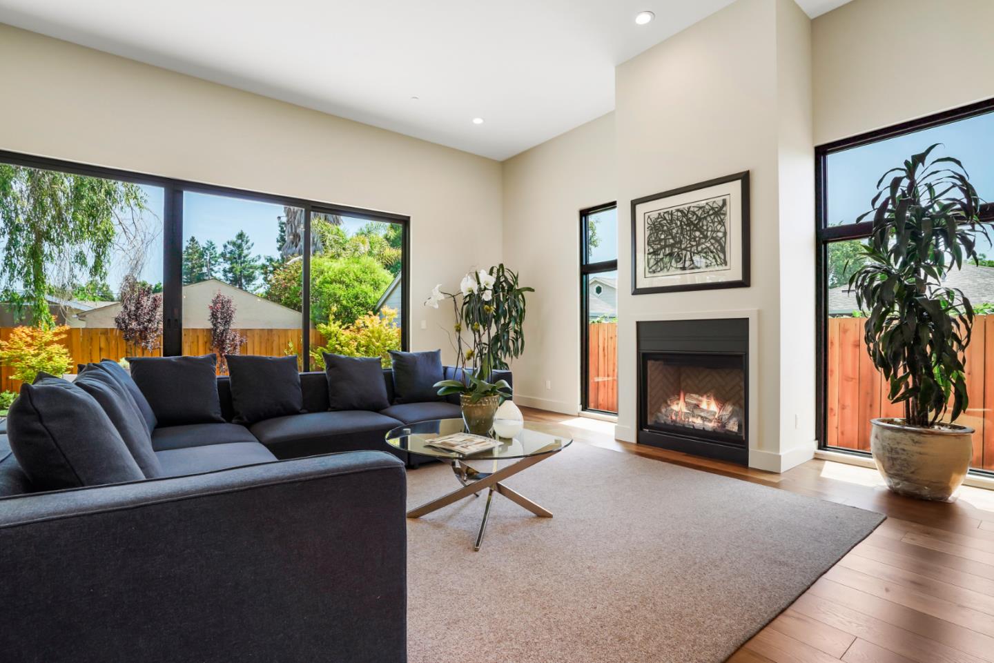 737 Ruby Street Redwood City, CA 94061 - Photo 5 of 26 a living room with furniture a large window and a fireplace