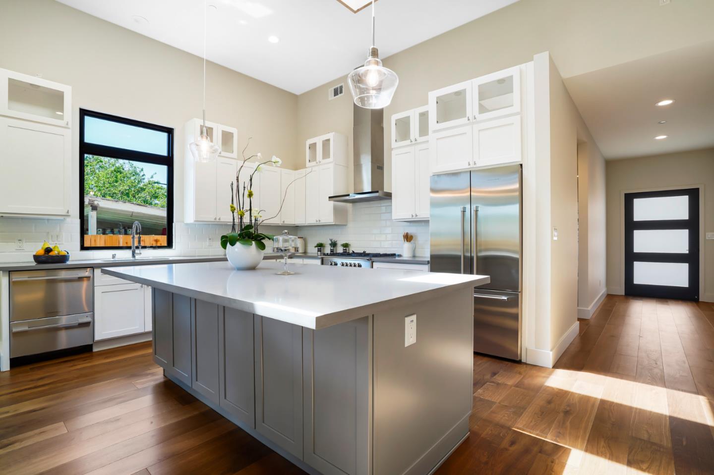 737 Ruby Street Redwood City, CA 94061 - Photo 8 of 26 a kitchen with kitchen island granite countertop a sink stove and refrigerator