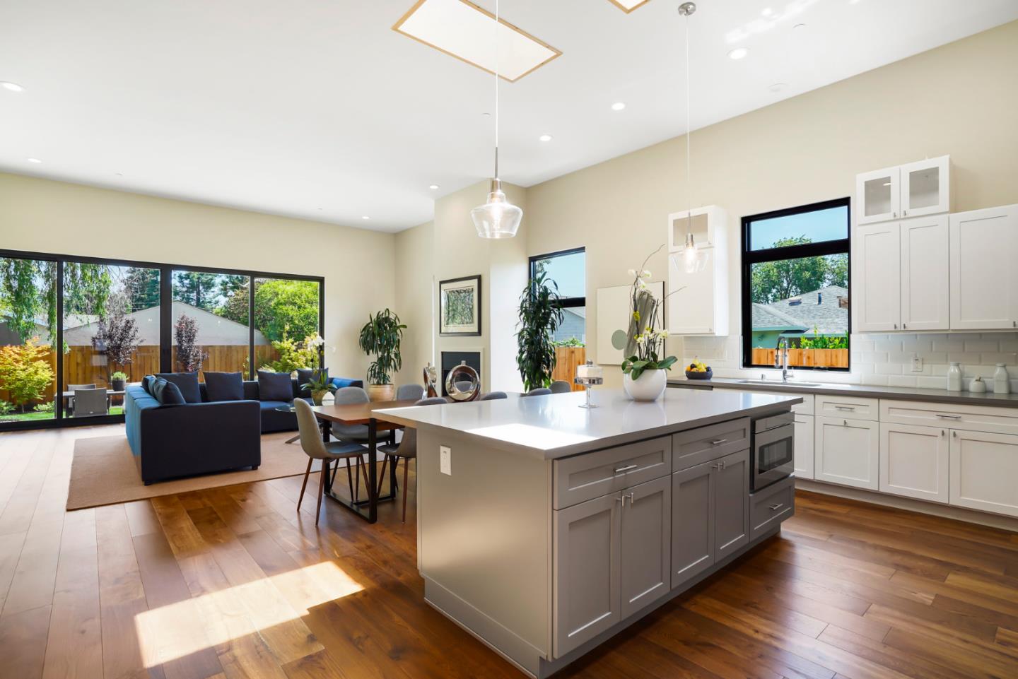 737 Ruby Street Redwood City, CA 94061 - Photo 10 of 26 a large kitchen with kitchen island a large island in it