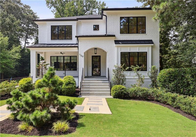 159 East Wesley Road Northeast Atlanta, GA 30305 - Photo 1 of 1 a front view of a house with garden
