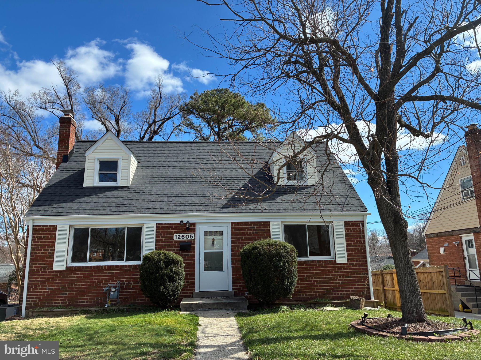 12605 Bluhill Road Silver Spring, MD 20906 - Photo 1 of 17 Charming brick home with lush greenery.