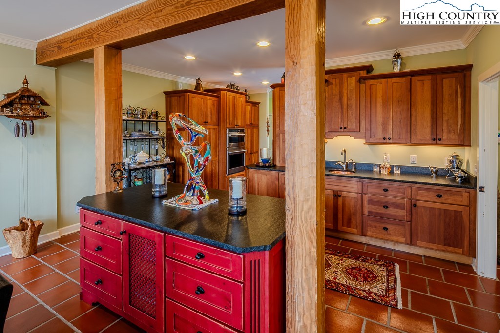 909 Daisy Ridge Road Banner Elk, NC 28604 - Photo 14 of 47 a kitchen with stainless steel appliances granite countertop a refrigerator and a stove
