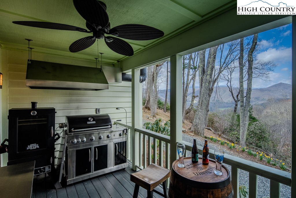 909 Daisy Ridge Road Banner Elk, NC 28604 - Photo 17 of 47 a living room with furniture and a fireplace