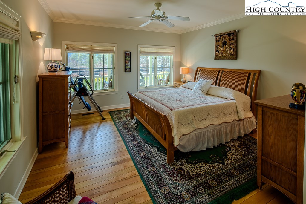 909 Daisy Ridge Road Banner Elk, NC 28604 - Photo 19 of 47 a bed sitting in a bedroom next to a window