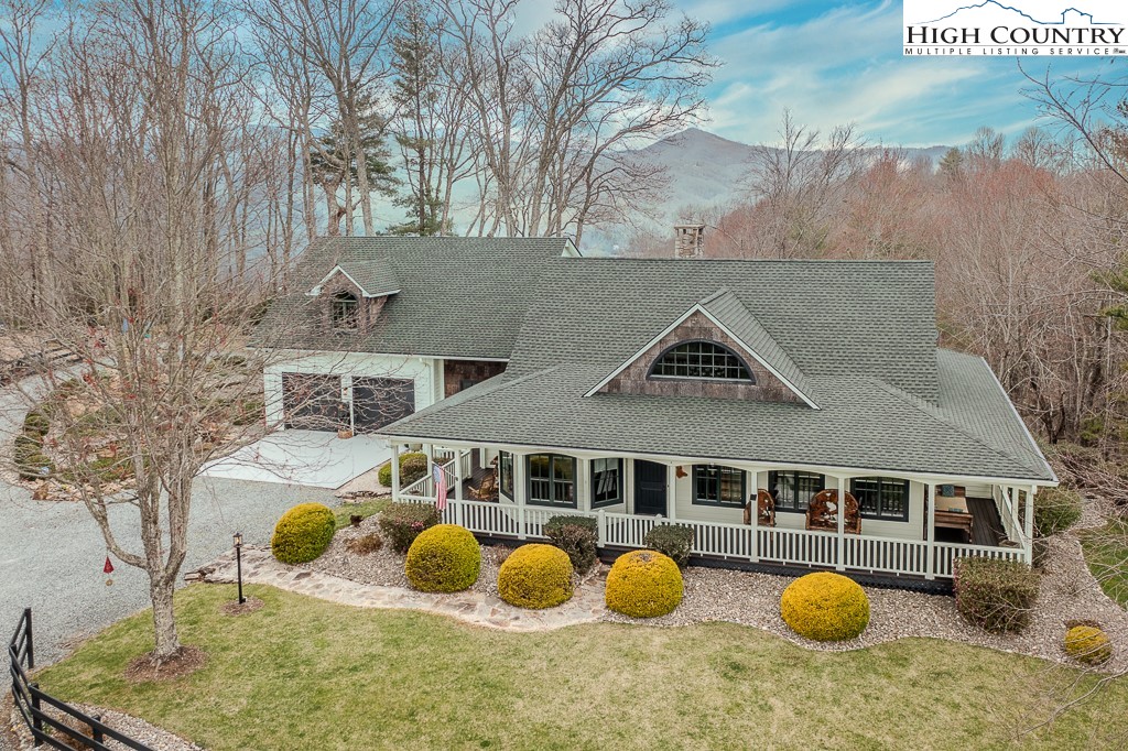 909 Daisy Ridge Road Banner Elk, NC 28604 - Photo 25 of 47 a front view of house with a tub and chairs