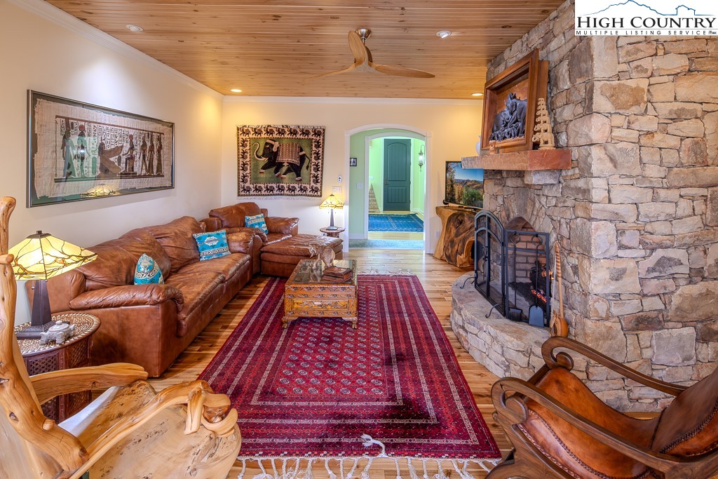 909 Daisy Ridge Road Banner Elk, NC 28604 - Photo 3 of 47 a living room with fireplace furniture and a fireplace