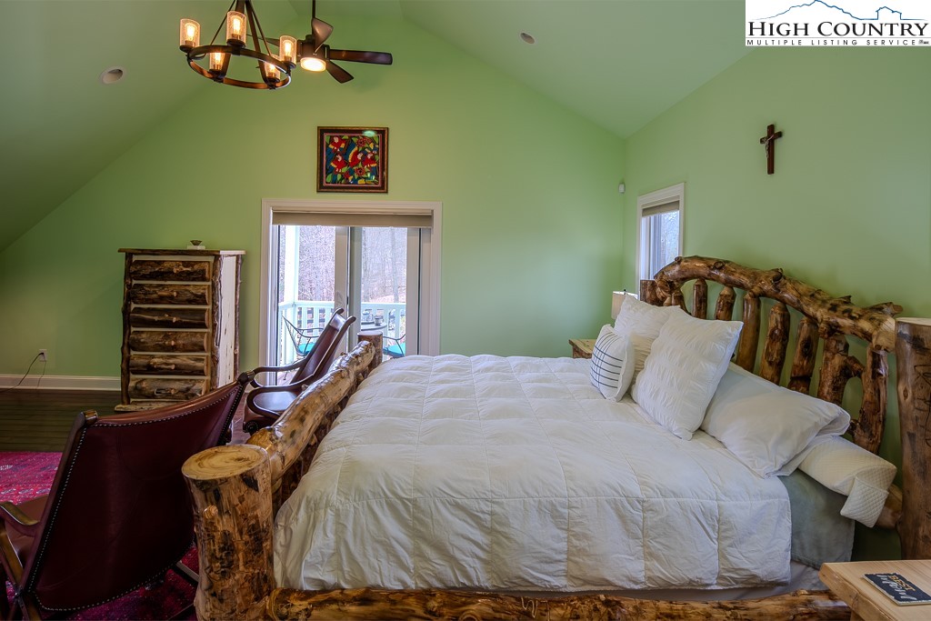 909 Daisy Ridge Road Banner Elk, NC 28604 - Photo 32 of 47 a bedroom with a bed and a window