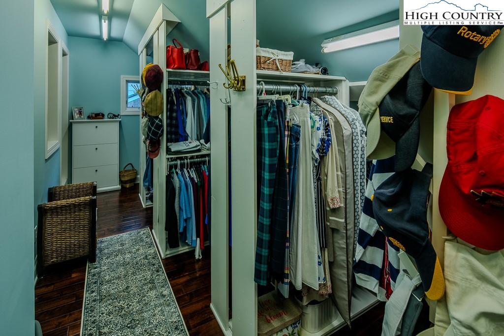909 Daisy Ridge Road Banner Elk, NC 28604 - Photo 36 of 47 a view of walk in closet with clothes and shoes